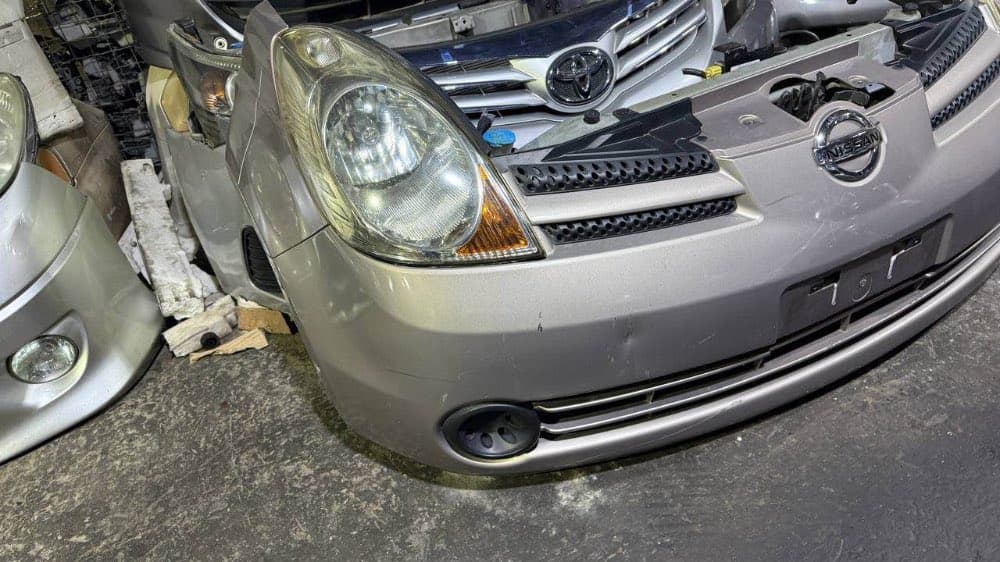 Bumper + Headlights Nissan Note used in Sharjah — photo 2