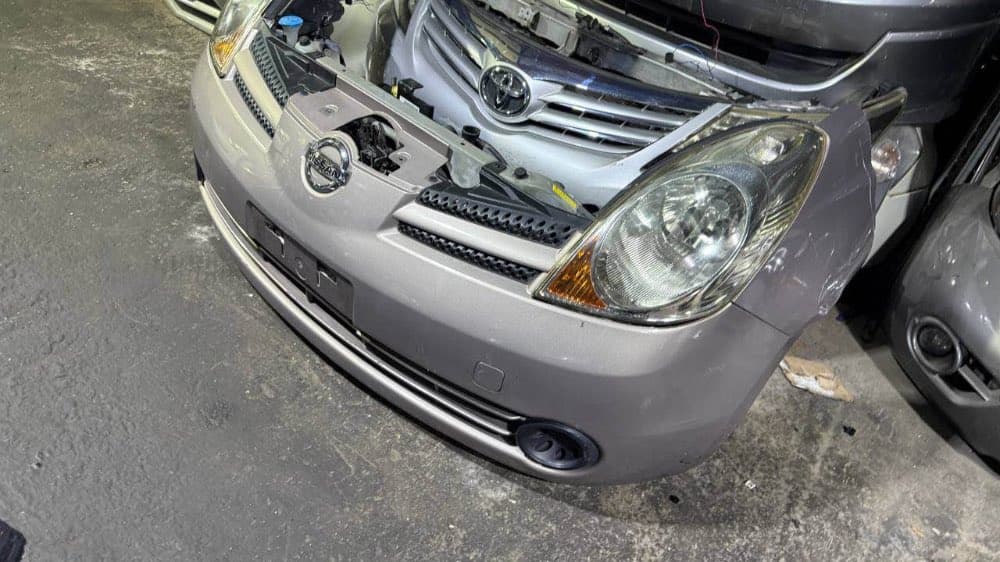 Bumper + Headlights Nissan Note used in Sharjah — photo 3