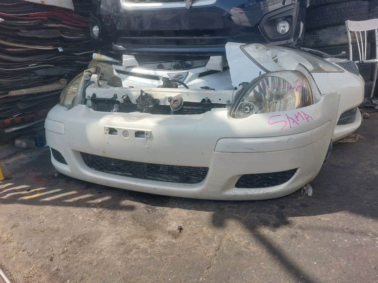 Bumper + Headlights Toyota Vitz