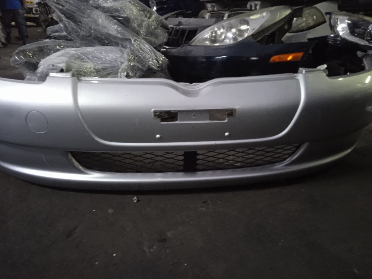 Bumper + Headlights Toyota Vitz