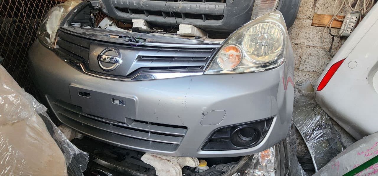 Bumper + Headlights Nissan Note used in Sharjah — photo 2
